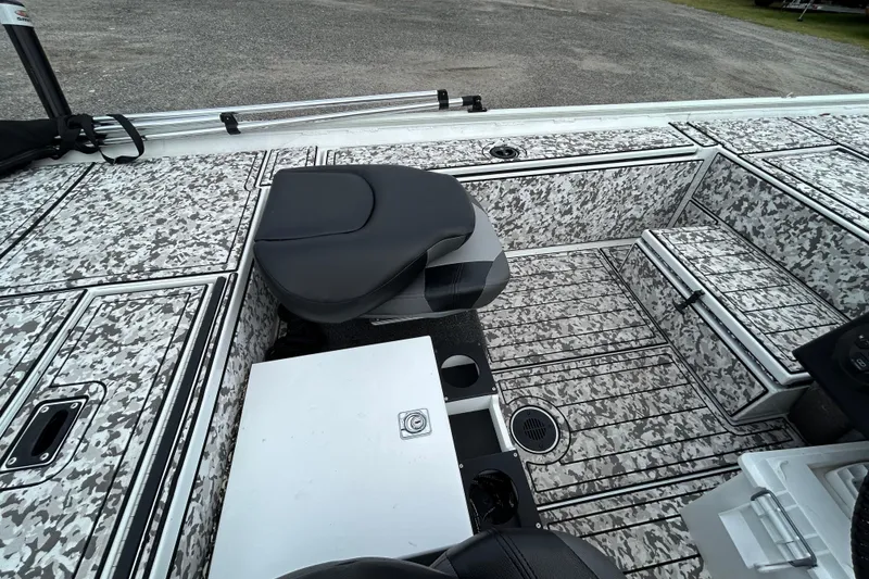 Slide: The Image of 2023 Crestliner 1600 Storm boat interior with camo pattern and seating. - 12