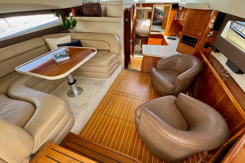 Slide: The Image of Luxurious interior of a 2009 Regal 4080 yacht with elegant seating and wooden flooring. - 14