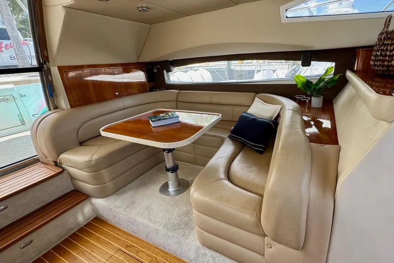 Slide: The Image of Luxurious interior of a 2009 Regal 4080 yacht with plush seating and elegant table. - 15