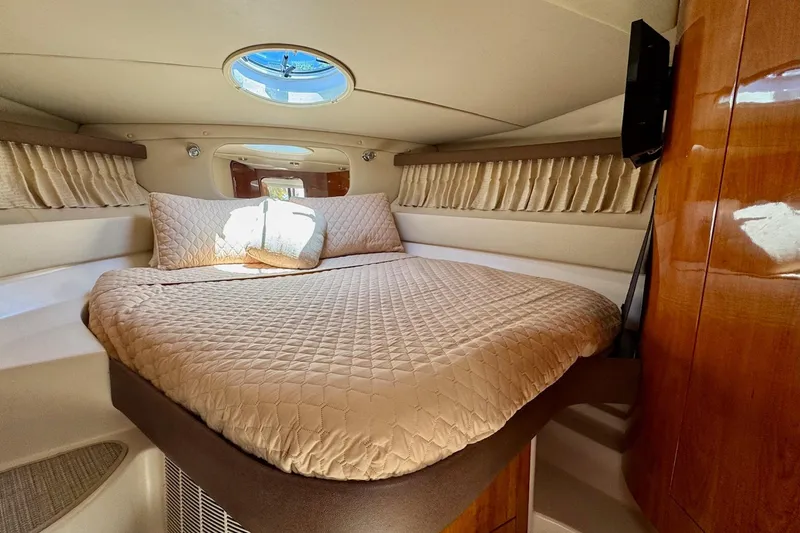 Slide: The Image of Luxurious cabin interior of 2009 Regal 4080 yacht with cozy bed and elegant decor. - 22