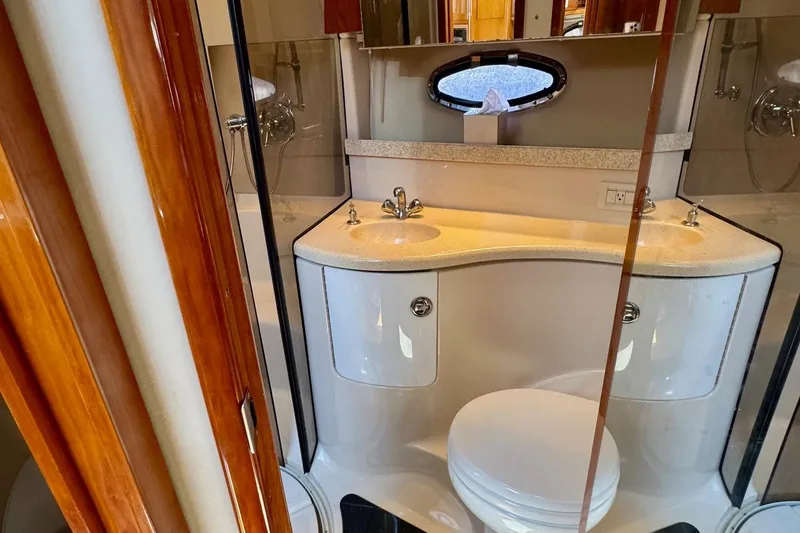 Slide: The Image of Luxurious 2009 Regal 4080 yacht bathroom with dual sinks and modern fixtures. - 25