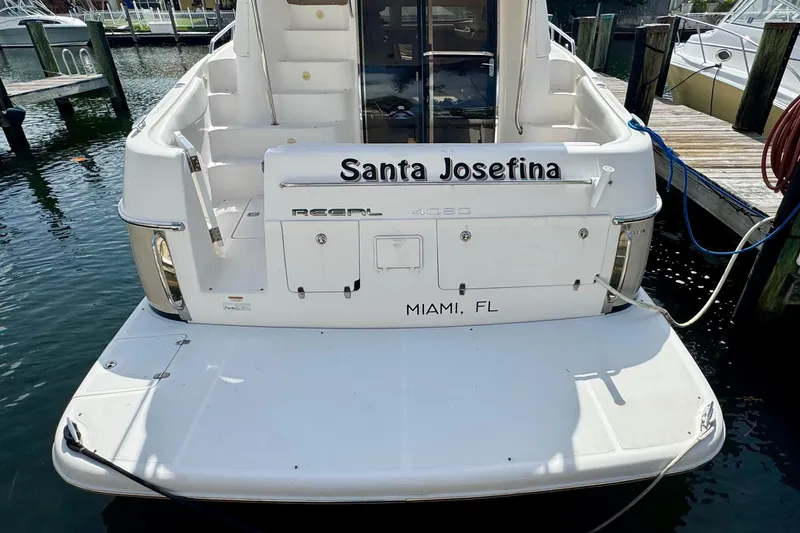 Slide: The Image of Rear view of 2009 Regal 4080 yacht named "Santa Josefina" docked in Miami, FL. - 3