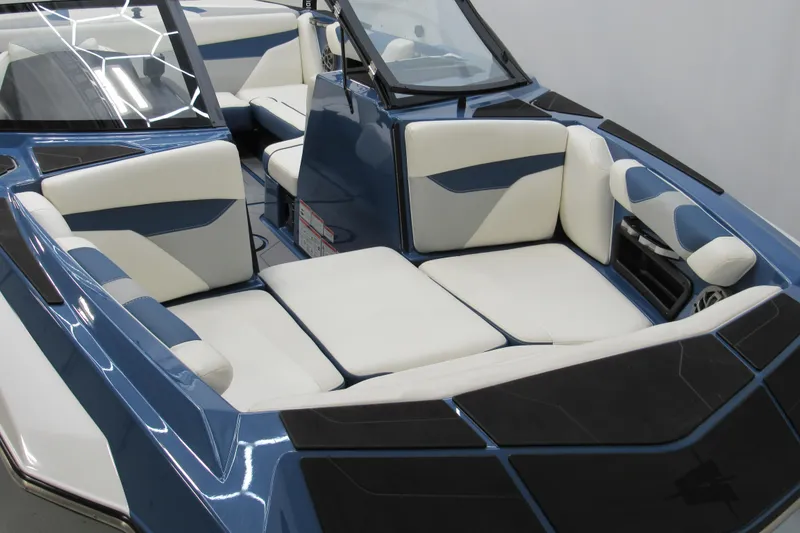 Slide: The Image of 2021 Axis A20 boat interior with blue and white seating, modern design. - 10