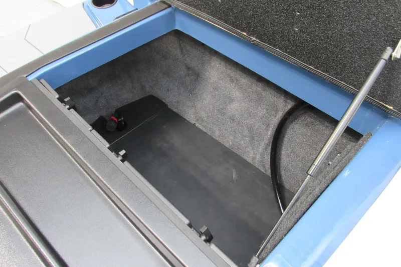 Slide: The Image of 2021 Axis A20 boat storage compartment with open lid and hydraulic support. - 14