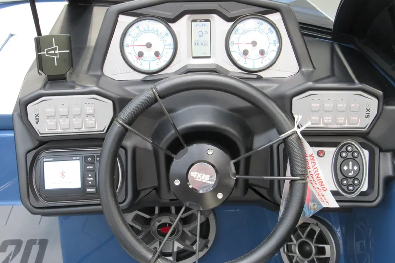 Slide: The Image of Dashboard of a 2021 Axis A20 boat with steering wheel and control panels. - 7