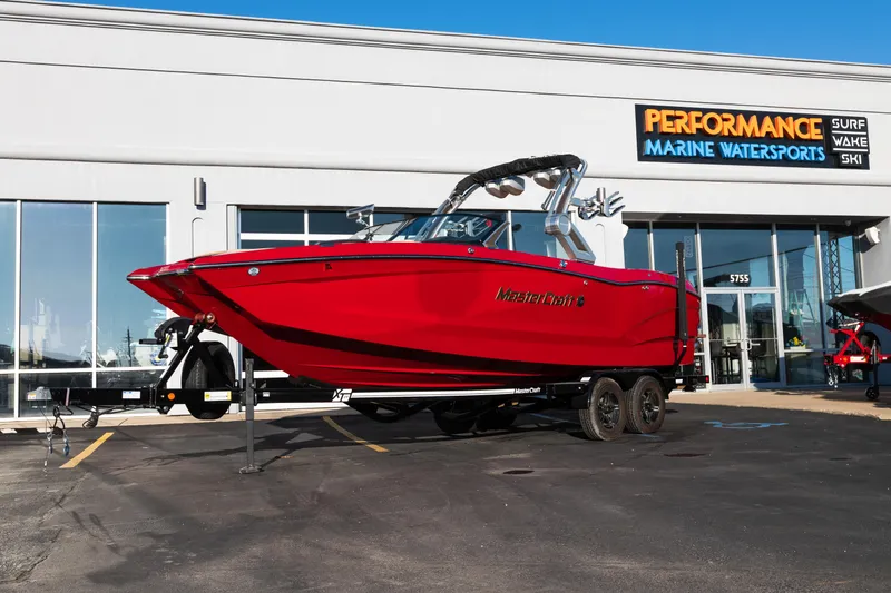 Slide: The Image of 2022 MasterCraft X24 boat in vibrant red at Performance Marine Watersports dealership. - 1