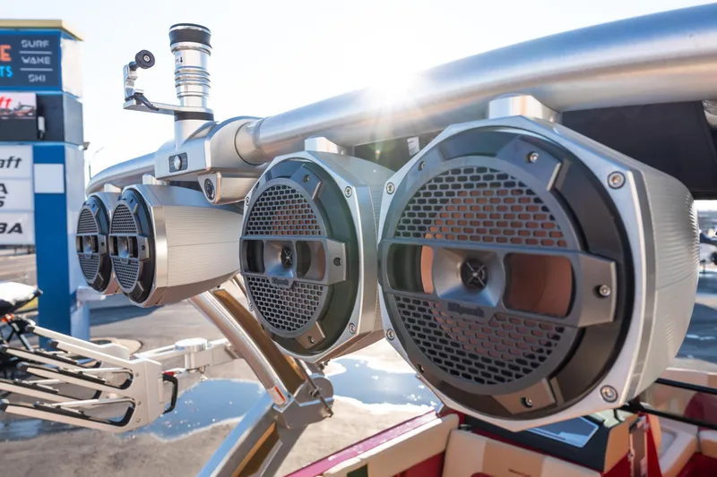 Slide: The Image of 2022 MasterCraft X24 boat speakers with sunlight and signage in the background. - 14