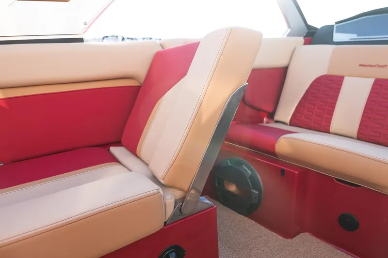 Slide: The Image of 2022 MasterCraft X24 interior with red and beige seating, showcasing luxury boat design. - 17
