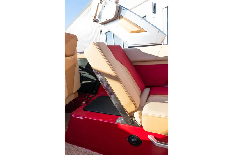 Slide: The Image of 2022 MasterCraft X24 interior seating with red and beige upholstery, showcasing luxury design. - 18