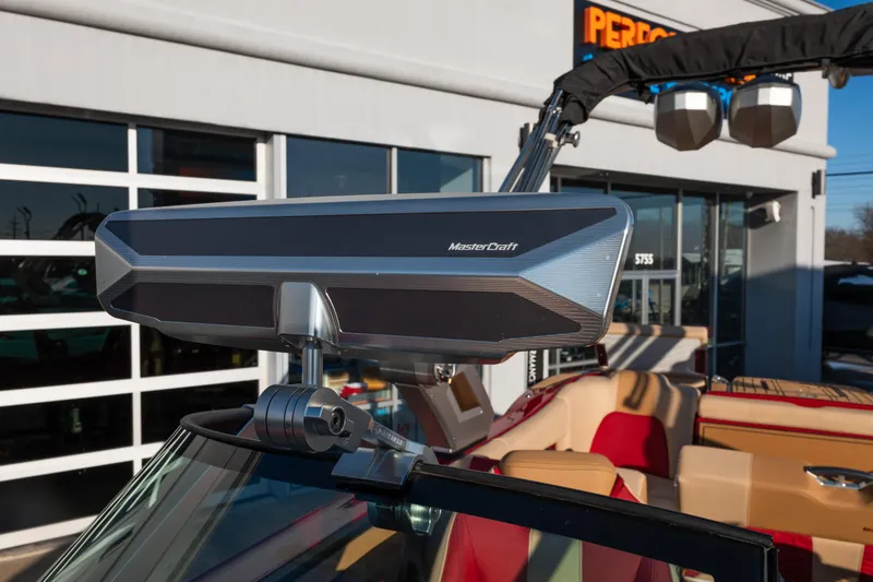 Slide: The Image of 2022 MasterCraft X24 boat with advanced rearview mirror, displayed at dealership. - 21