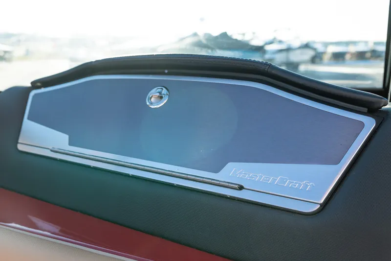 Slide: The Image of Dashboard of 2022 MasterCraft X24 boat with sleek design and logo. - 46