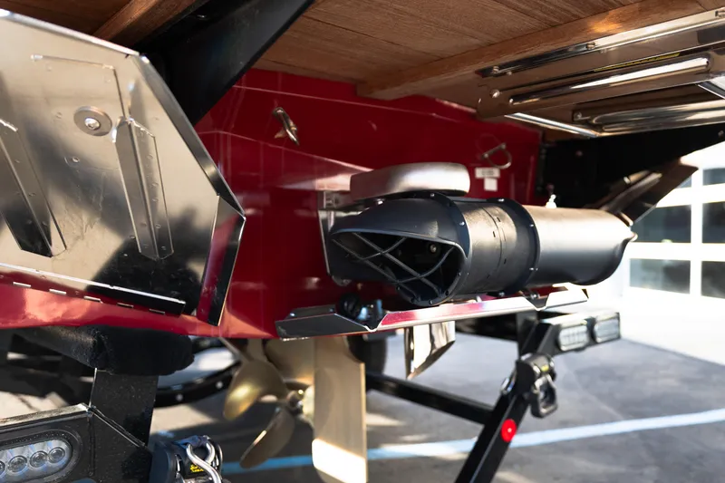 Slide: The Image of 2022 MasterCraft X24 boat underside with propeller and exhaust system. - 54