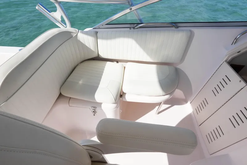 Slide: The Image of 2003 Grady-White Express 330 boat interior with white seating and ocean view. - 16