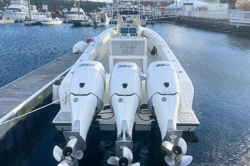 Slide: The Image of 2002 Contender 36 Open boat with triple 350 engines docked at marina. - 4