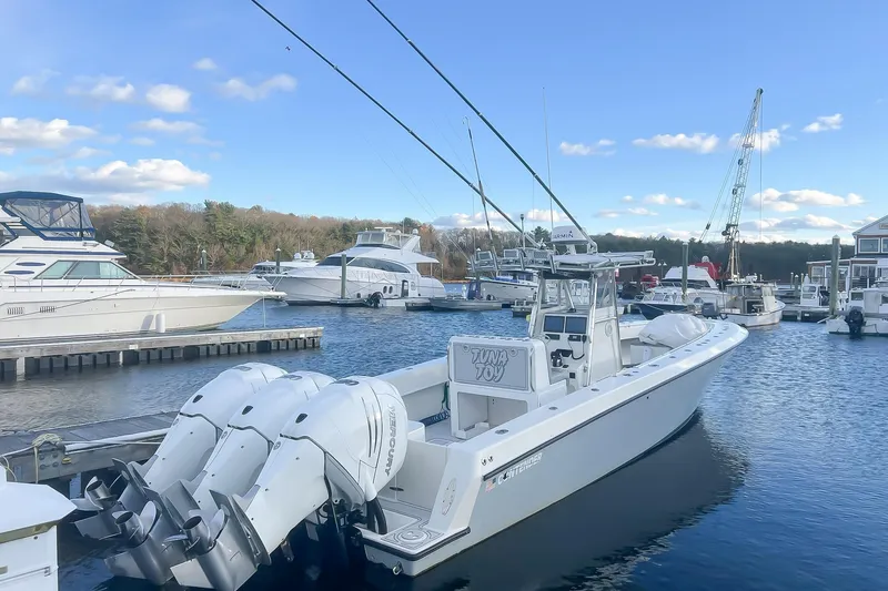 Slide: The Image of 2002 Contender 36 Open boat docked in a marina with clear blue skies. - 5