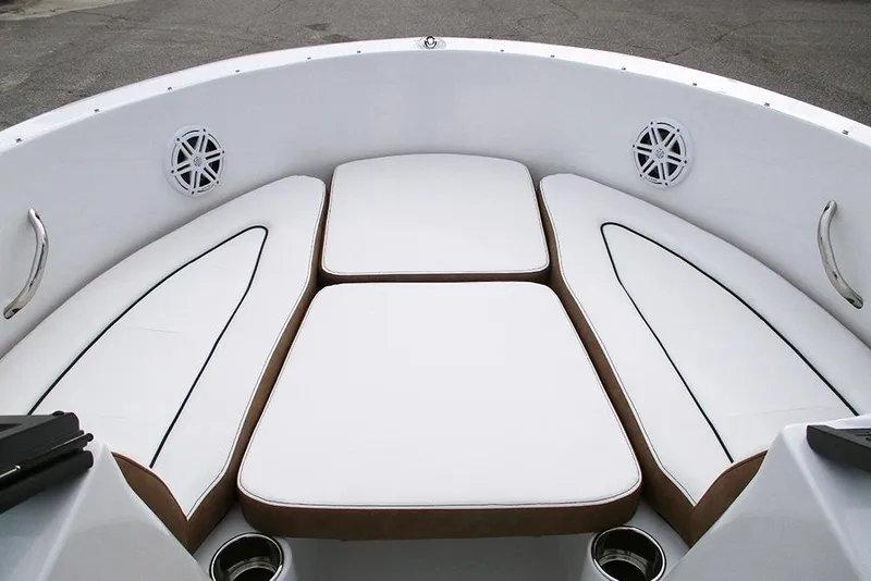 Slide: The Image of 2026 Stingray 172 DC boat interior with white cushioned seating and cup holders. - 11