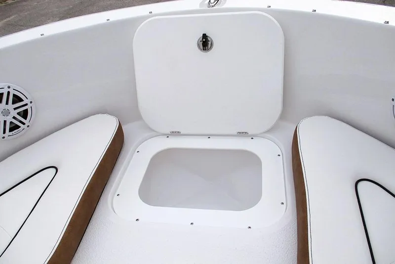 Slide: The Image of 2026 Stingray 172 DC boat interior with storage compartment and cushioned seating. - 13