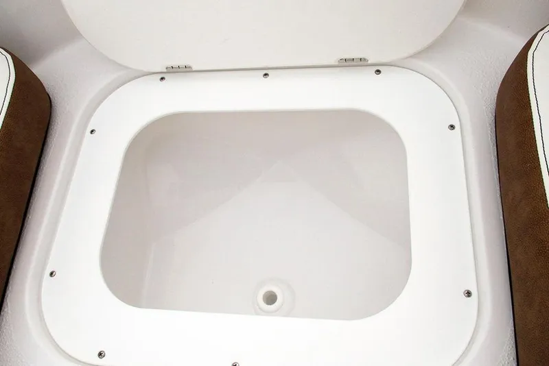 Slide: The Image of Open storage compartment in 2026 Stingray 172 DC boat interior. - 14