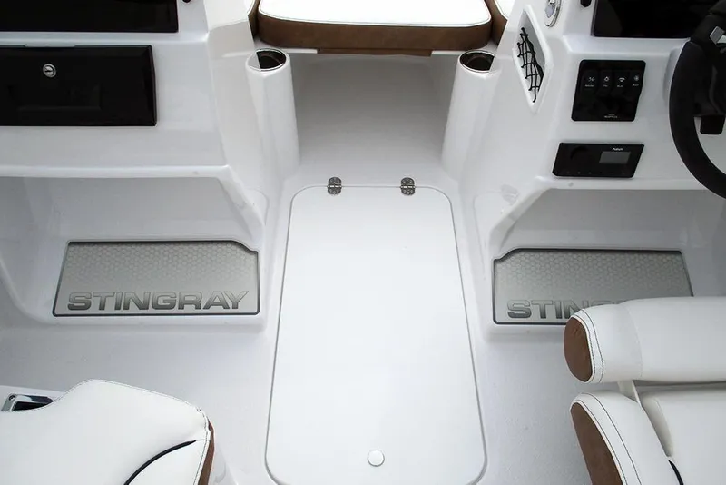 Slide: The Image of Interior view of 2026 Stingray 172 DC boat, featuring sleek white design and seating. - 15