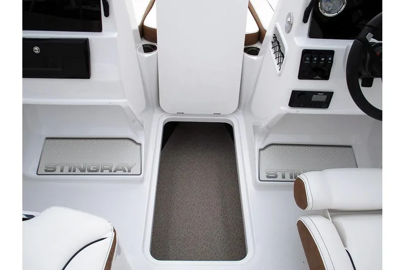 Slide: The Image of Interior of 2026 Stingray 172 DC boat, featuring sleek white design and modern controls. - 16