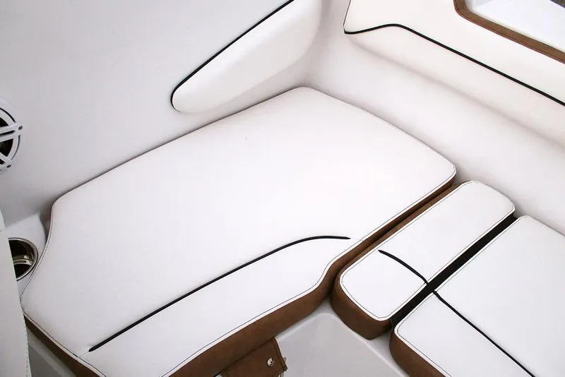 Slide: The Image of 2026 Stingray 172 DC boat interior with white cushioned seating and sleek design. - 19