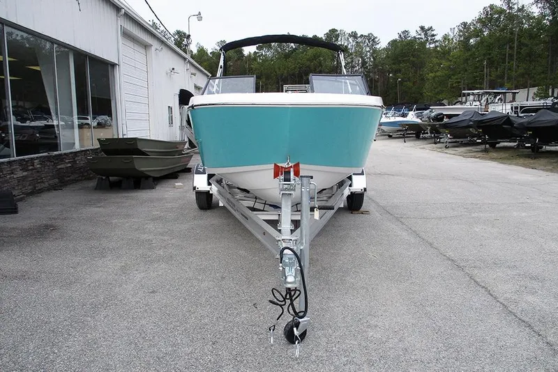 Slide: The Image of 2026 Stingray 172 DC boat on trailer at dealership, front view. - 4