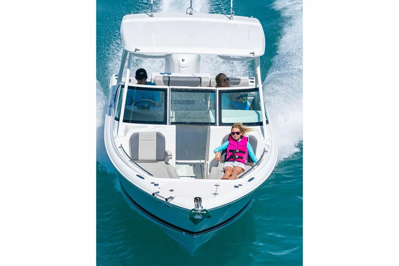 Slide: The Image of 2026 Pursuit DC 246 Dual Console boat with Yamaha engine at indoor exhibit. - 4