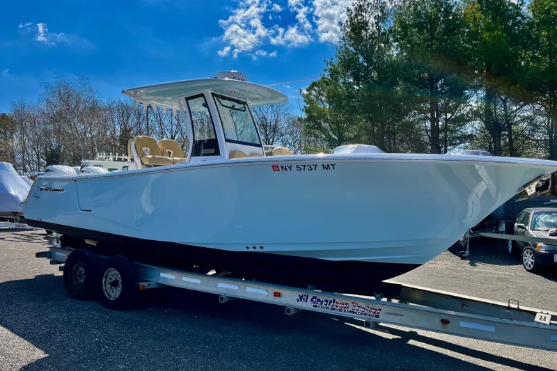 The Image of 2024 Sportsman Open 262 Center Console on trailer, parked outdoors. - 0