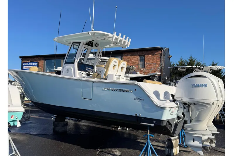 Slide: The Image of 2024 Sportsman Open 262 Center Console boat on a lot. - 2