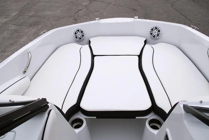Slide: The Image of 2026 Stingray 191 DC boat interior with white cushioned seating and cup holders. - 11