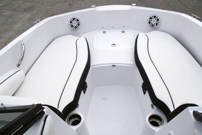 Slide: The Image of 2026 Stingray 191 DC boat interior with white cushioned seating and cup holders. - 14