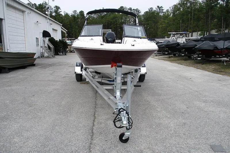 Slide: The Image of 2026 Stingray 191 DC boat on trailer in outdoor storage area. - 4