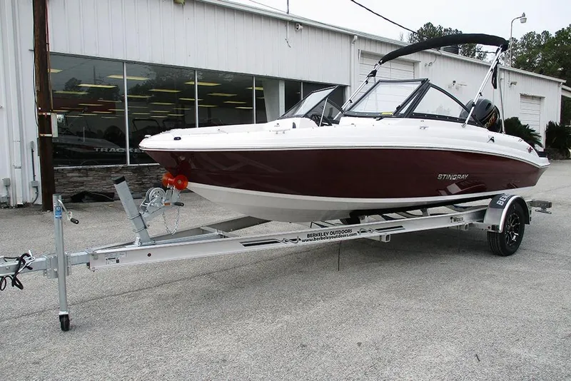 Slide: The Image of 2026 Stingray 191 DC boat on trailer outside dealership. - 5