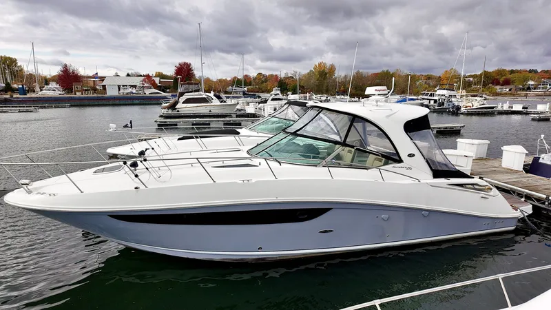 Slide: The Image of 2016 Sea Ray Sundancer 370 docked, cloudy sky. - 2