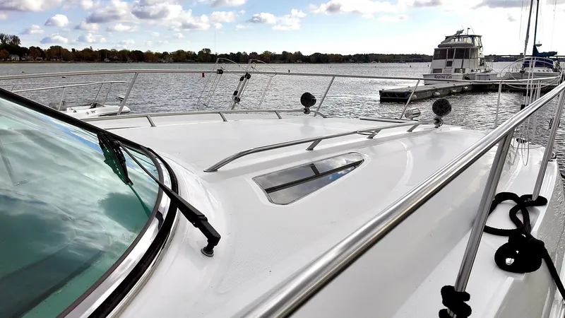 Slide: The Image of 2016 Sea Ray Sundancer 370 on calm waters. - 9