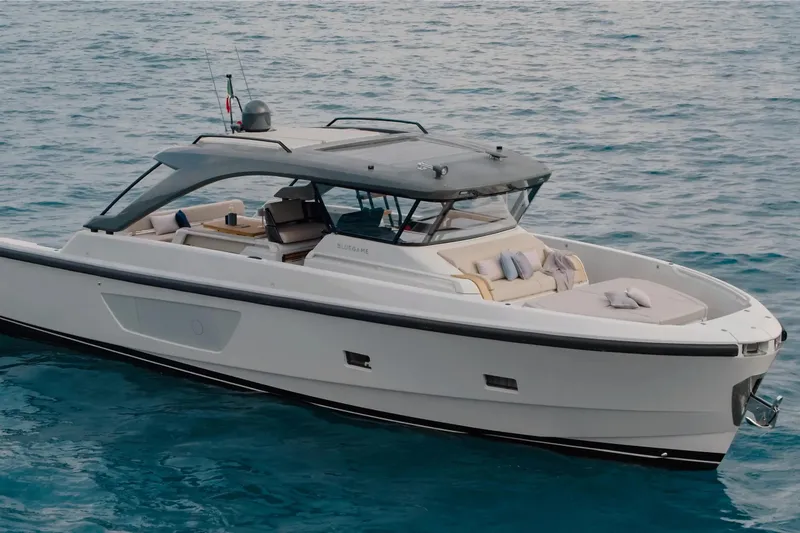 The Image of 2025 Bluegame BG54 yacht cruising on calm blue waters. - 0