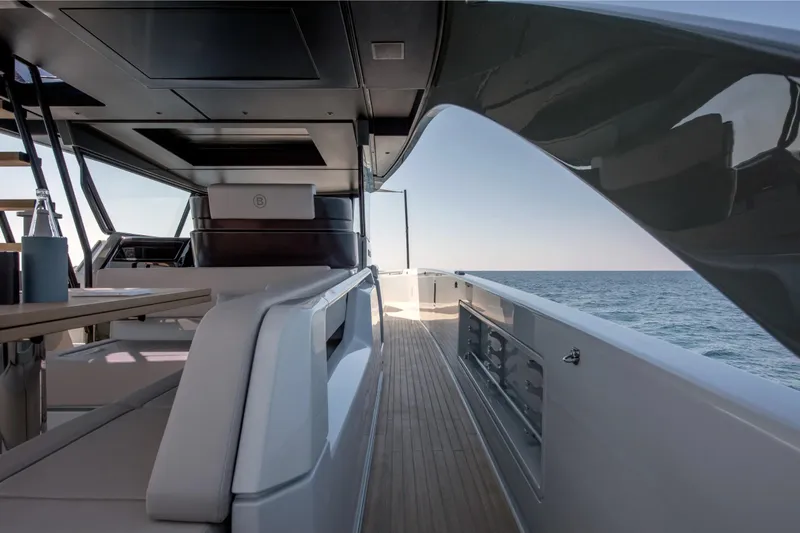 Slide: The Image of Luxurious 2025 Bluegame BG54 yacht interior with ocean view, featuring sleek design and modern amenities. - 10