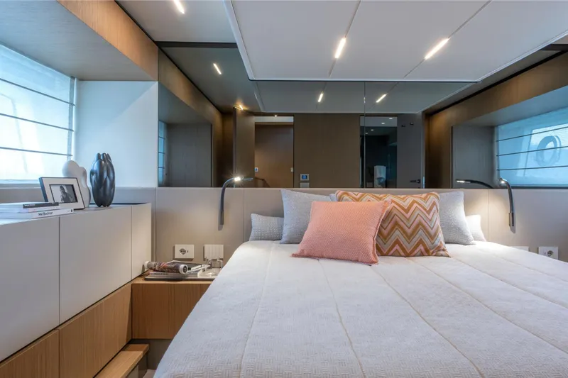 Slide: The Image of Luxurious bedroom interior of 2025 Bluegame BG54 yacht with modern decor and ambient lighting. - 13