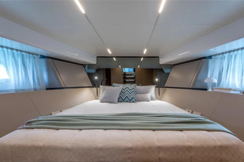 Slide: The Image of Luxurious interior of 2025 Bluegame BG54 yacht with elegant bedding and modern lighting. - 14