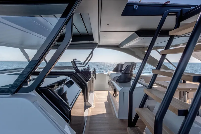 Slide: The Image of Interior view of 2025 Bluegame BG54 yacht, featuring modern design and ocean backdrop. - 5