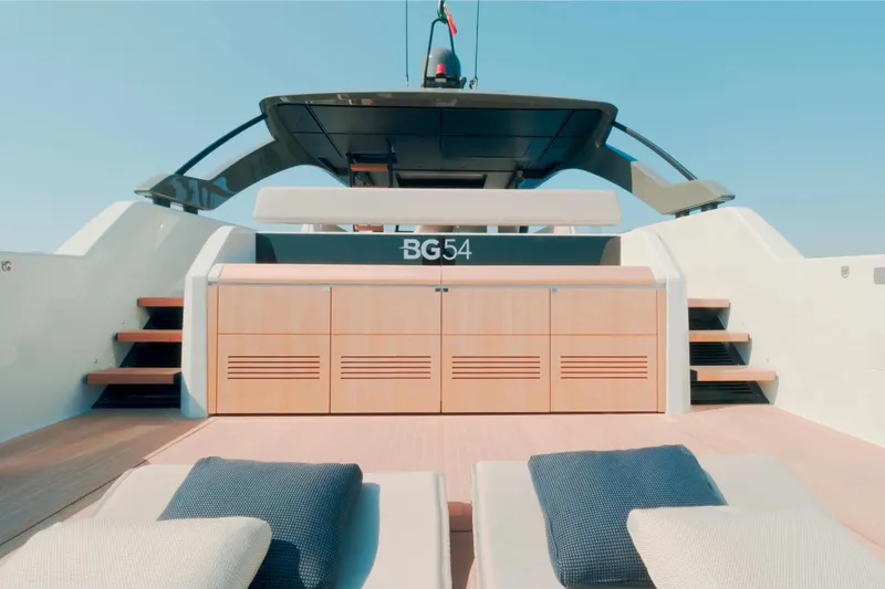 Slide: The Image of 2025 Bluegame BG54 yacht deck with modern design and comfortable seating. - 7