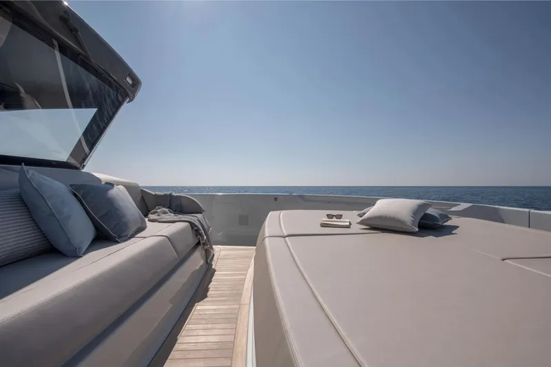 Slide: The Image of Luxurious 2025 Bluegame BG54 yacht deck with cushions, ocean view, and clear sky. - 8
