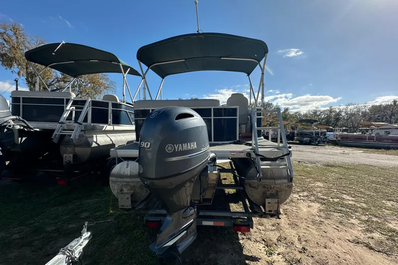 Slide: The Image of 2022 Sweetwater 2086 CX pontoon boat with Yamaha 90 engine, parked outdoors. - 15