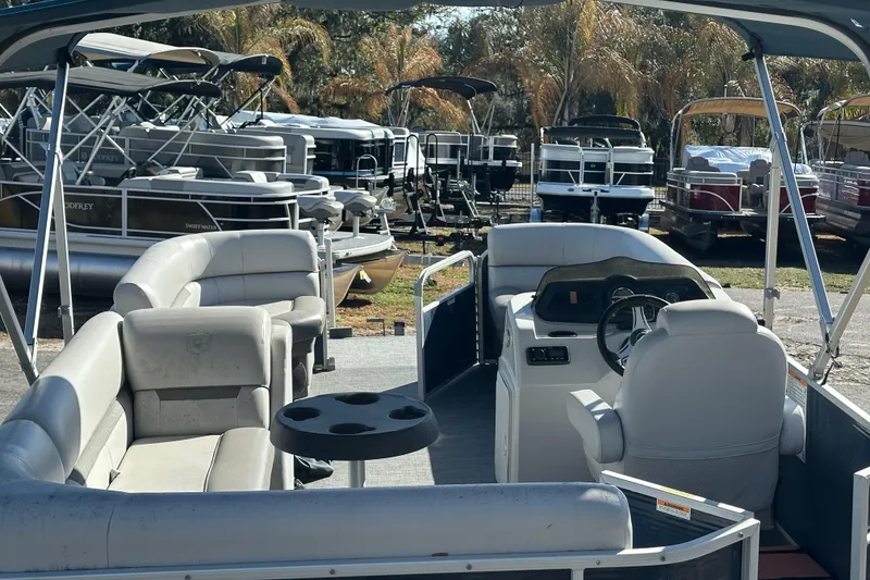 Slide: The Image of 2022 Sweetwater 2086 CX pontoon boat with spacious seating and modern helm. - 6
