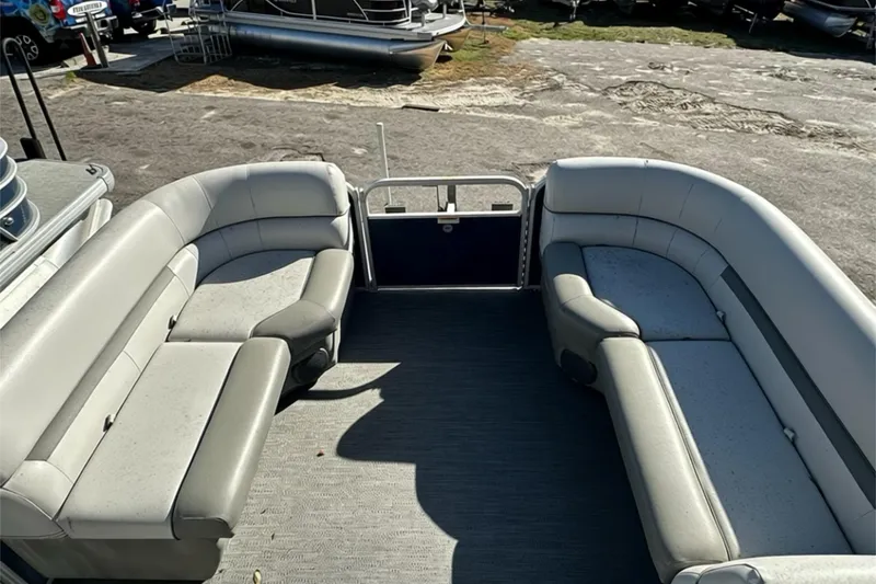 Slide: The Image of Interior view of 2022 Sweetwater 2086 CX pontoon boat with spacious seating. - 7