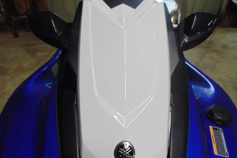 Slide: The Image of 2024 Yamaha WaveRunner JetBlaster, top view, showcasing sleek design and vibrant blue color. - 13