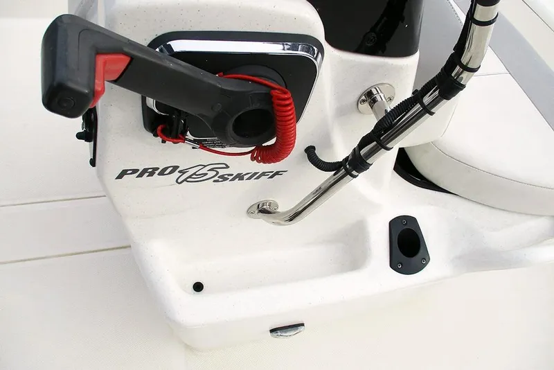 Slide: The Image of 2024 Mako Pro Skiff 15 CC boat console with steering and controls. - 20