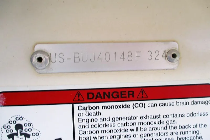 Slide: The Image of 2024 Mako Pro Skiff 15 CC hull identification number and carbon monoxide warning label. - 21