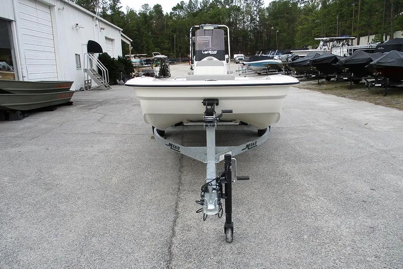Slide: The Image of 2024 Mako Pro Skiff 15 CC on trailer in outdoor boatyard. - 4
