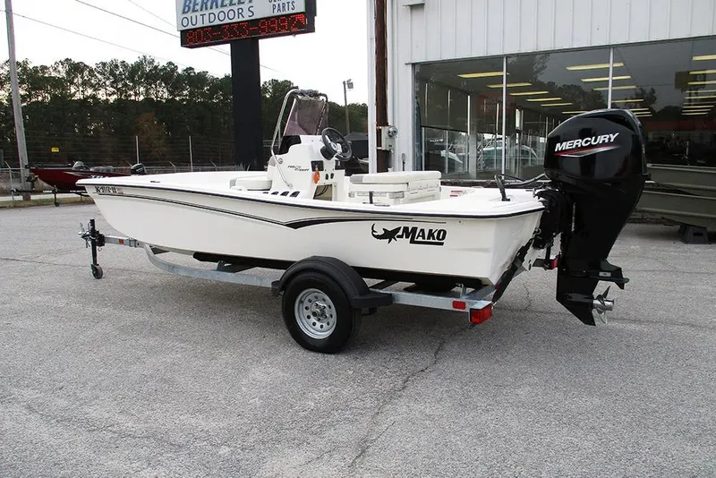 Slide: The Image of 2024 Mako Pro Skiff 15 CC boat with Mercury engine on trailer. - 7